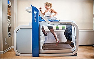 A woman is running on a treadmill.