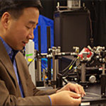 Xingde Li works in his microscope lab.