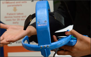 The prototype is shown as a student holds it.