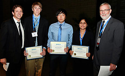 Students gather for a group photo holding their awards.