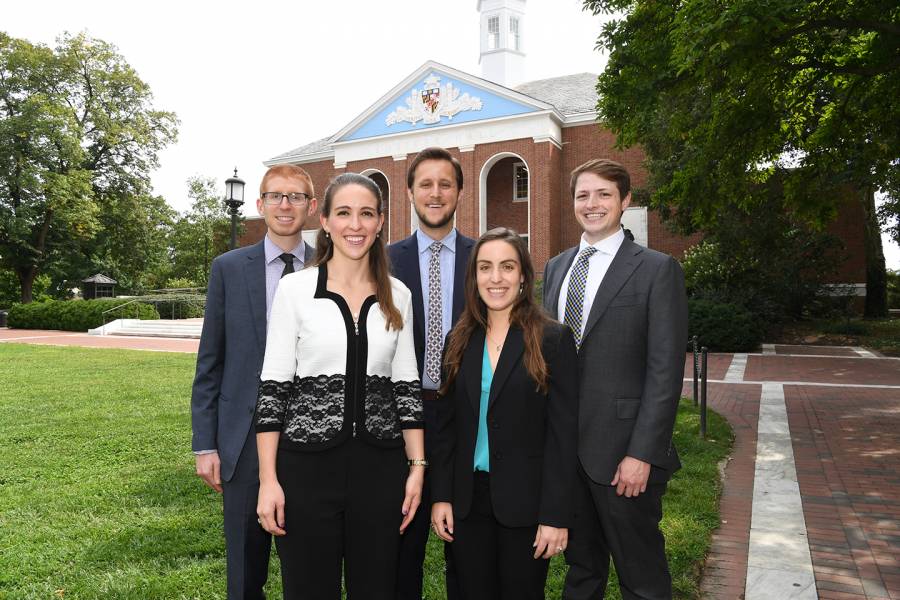 The five Siebel Scholars stand outside and pose for a photo.