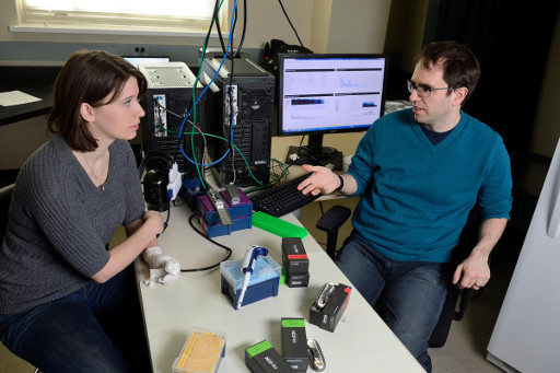 Timp and Workman discuss the study in his lab.