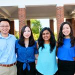 Four students from Team Relavo stand together for a picture.