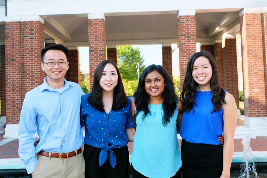 Four students from Team Relavo stand together for a picture.