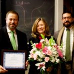 Eileen Haase receives an award from the Dean.