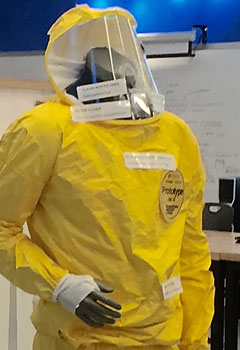 A yellow ebola suit is on a mannequin.