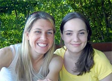 Two girls smile for the camera.