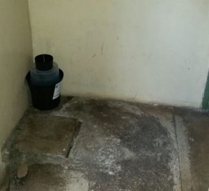 A mosquito trap sits on the floor.
