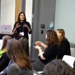 Sri Sarma is speaking to a group of female scientists.