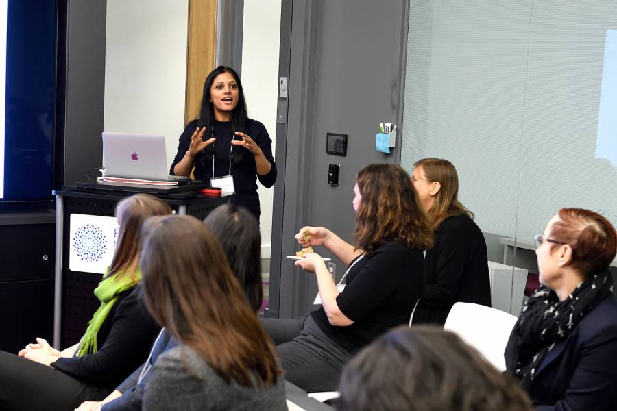 Sri Sarma is speaking to a group of female scientists.