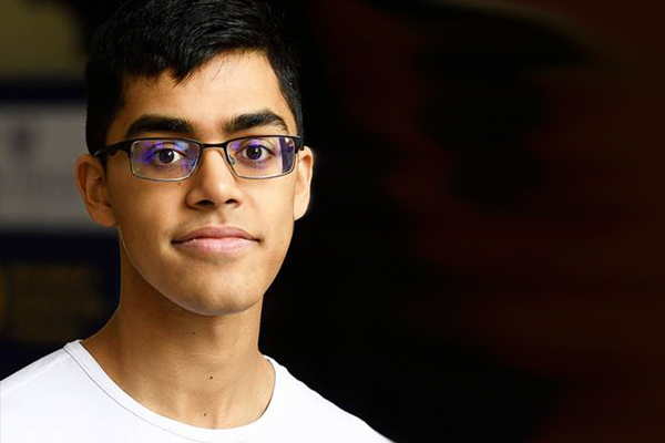 Vinay Ayyappan stands for a headshot photo.