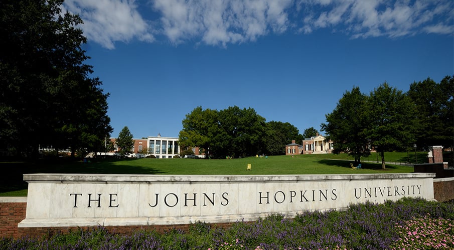 A large Johns Hopkins sign is seen outside.