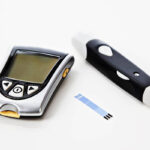 A glucose monitor is pictured on a white background.