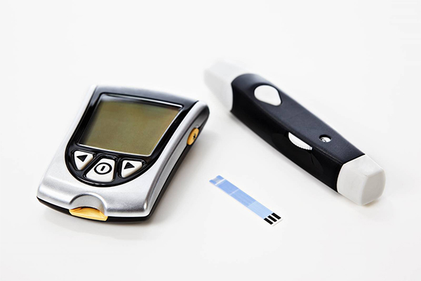 A glucose monitor is pictured on a white background.