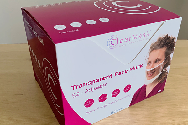 A box of ClearMasks appears on a table.
