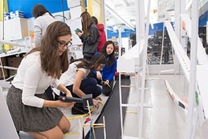 Students work on their foam core projects in the Design Studio.