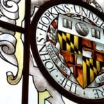 The Johns Hopkins University crest is shown.