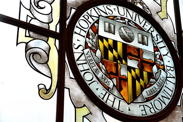 The Johns Hopkins University crest is shown.