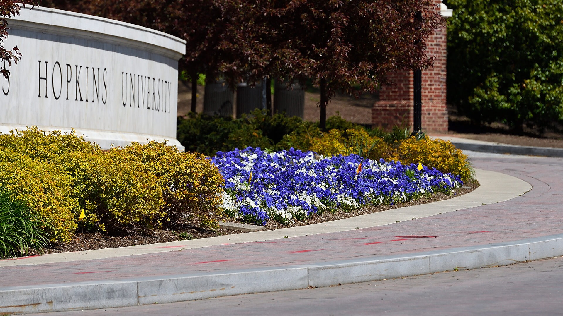 JHU sign appears on campus.