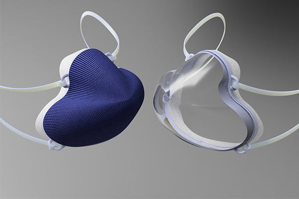 A mask with a blue front is shown next to a mask with a clear front.