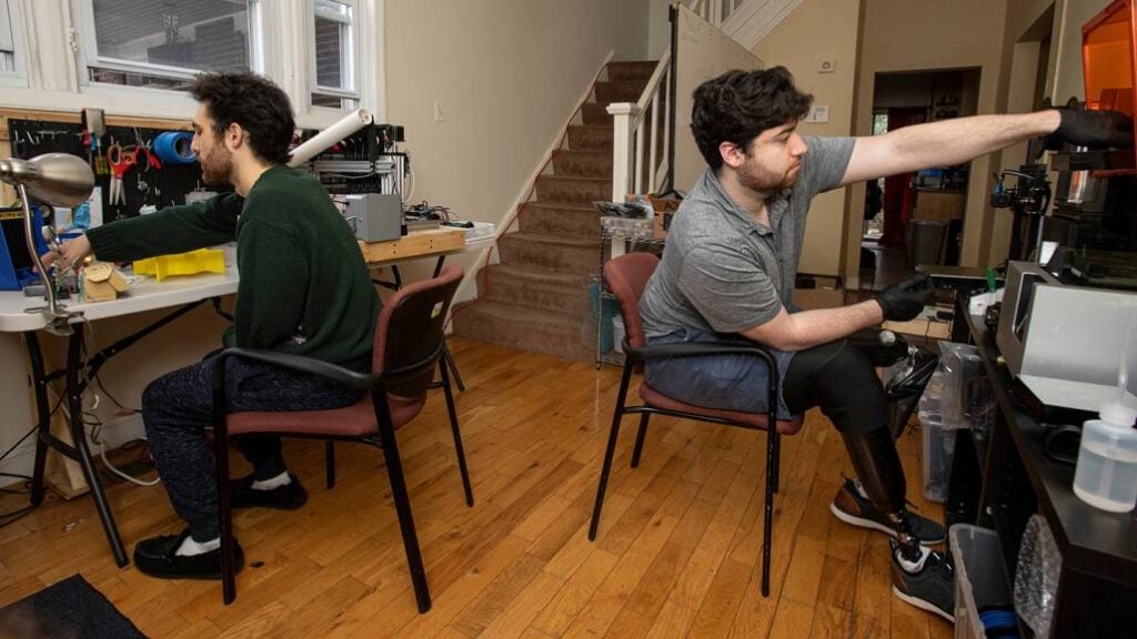 Chris and Mark are working in the lame shift design studio in their living room.