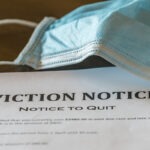 An eviction notice is shown next to a surgical mask.