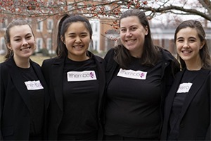 A group of women stand together.