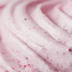 A close-up shot of pink ice cream with circular lines in it.